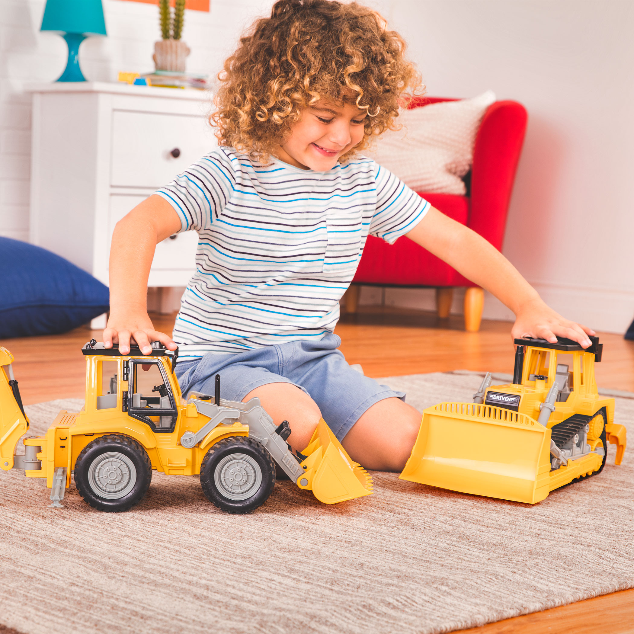 Boy playing with Midrange Backhoe Loader