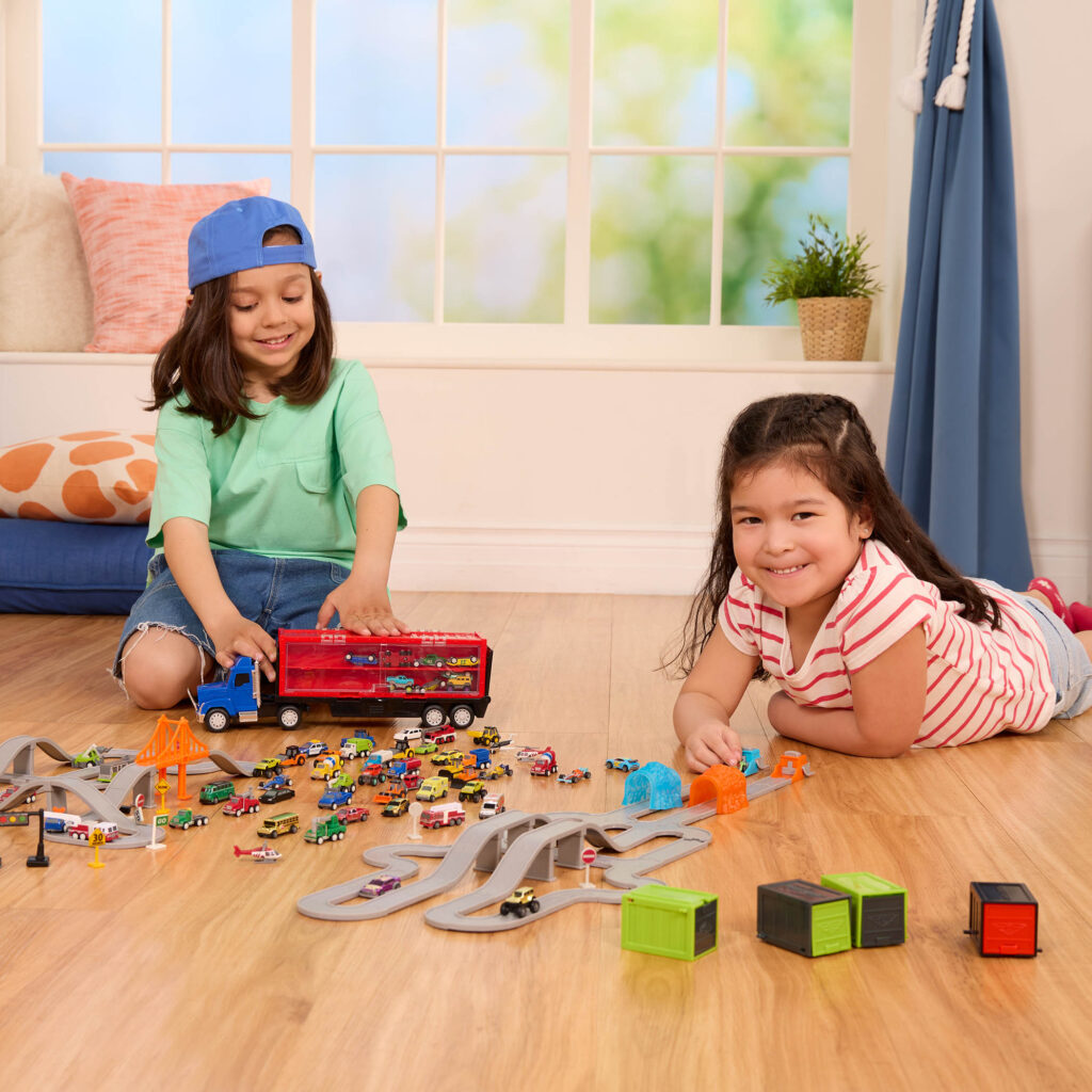 Kids with toy car tracks.