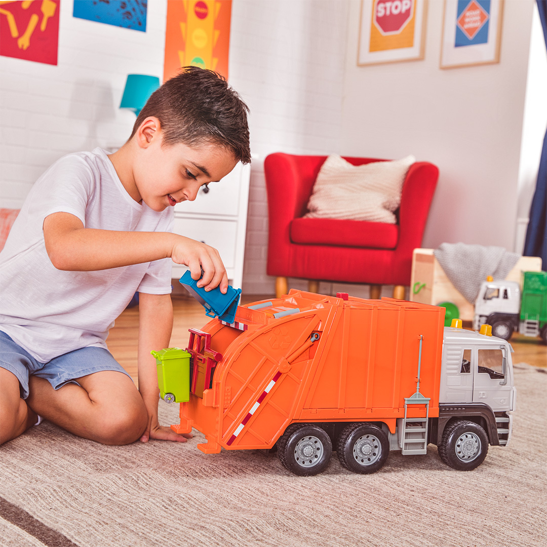 Boy playing with Standard Orange Recycling Truck